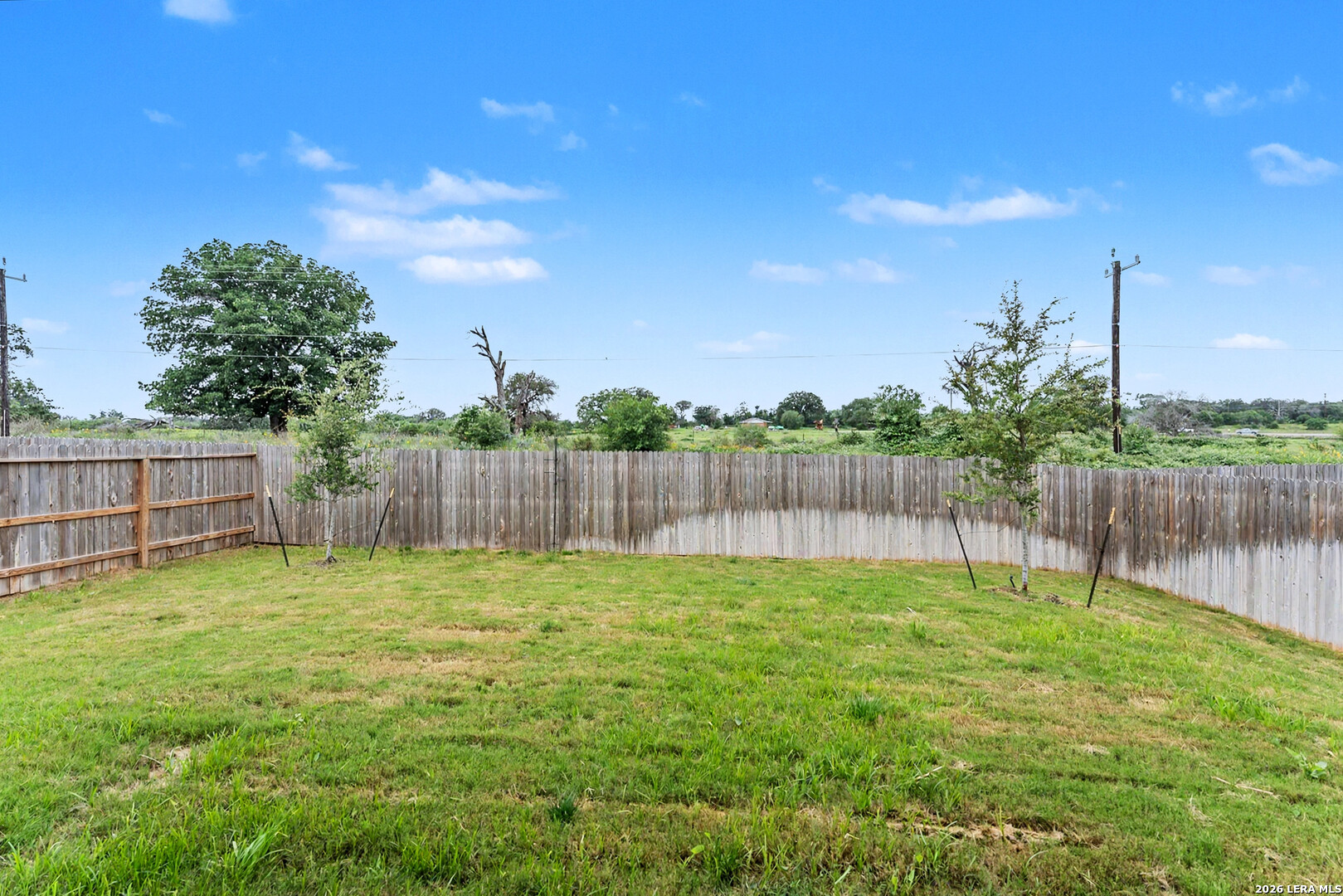 16515 Rosemary Ridge Elmendorf, TX 78112 - Photo 27 of 27 a garden with wooden fence