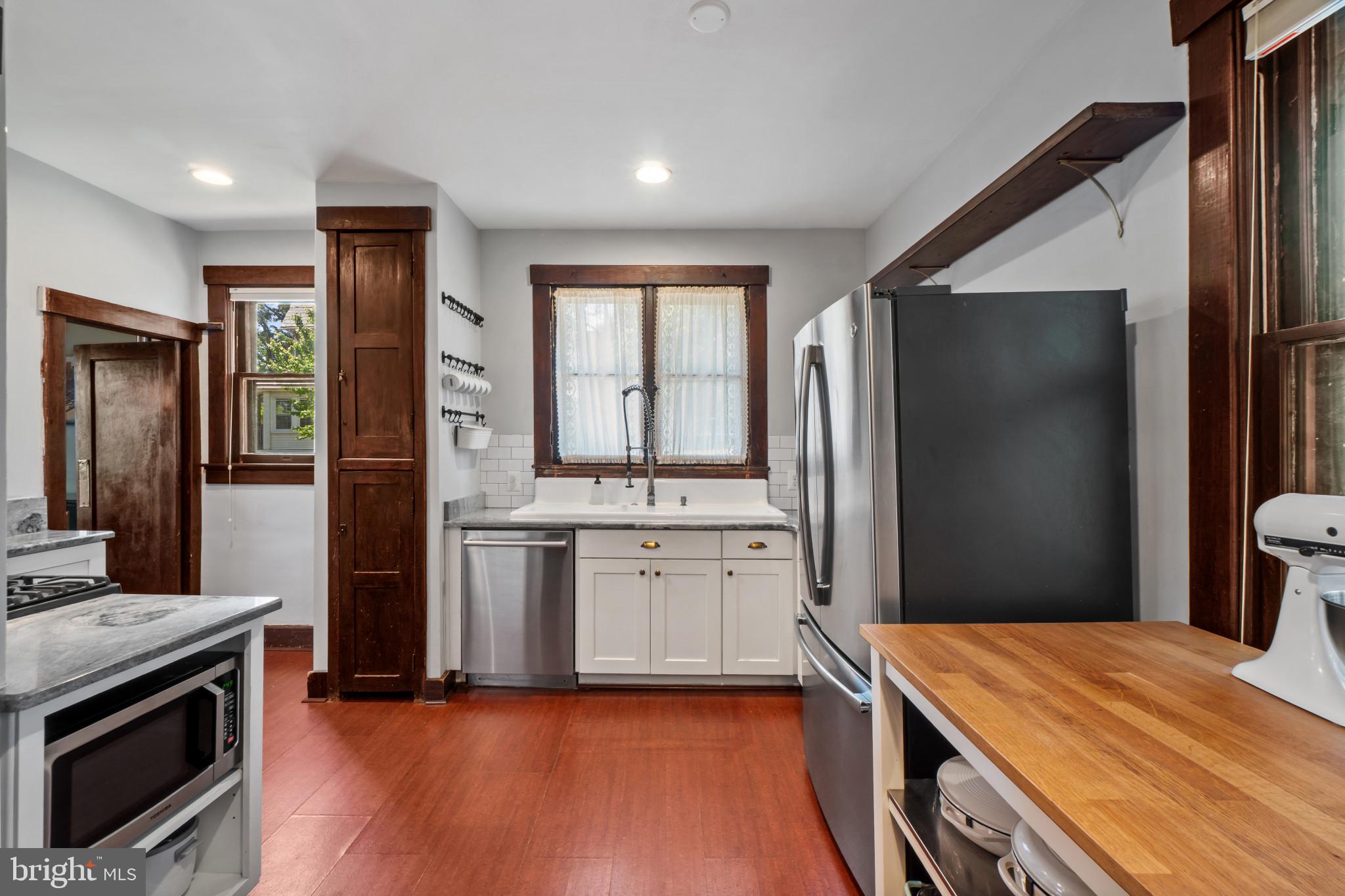 2900 Rueckert Avenue Baltimore, MD 21214 - Photo 14 of 40 a kitchen with stainless steel appliances granite countertop a refrigerator and a stove top oven