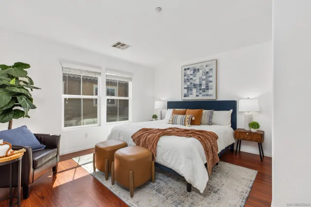 a bedroom with bed and a window