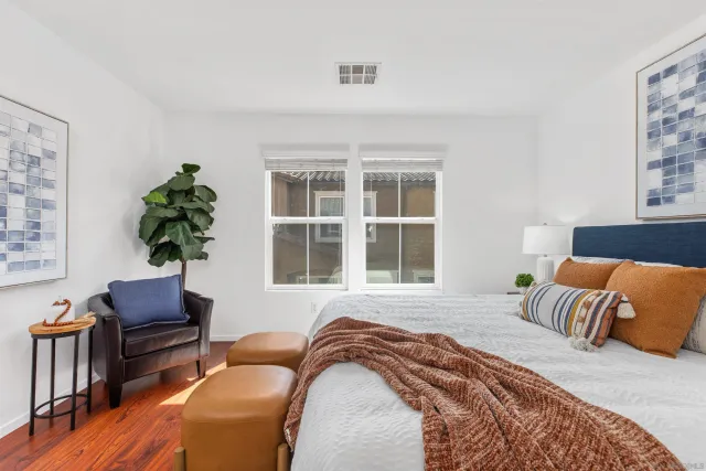 a bedroom with a bed and a couch