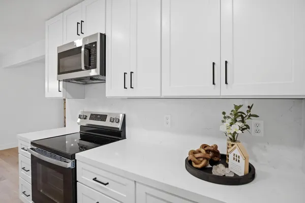 a kitchen with a stove and a microwave