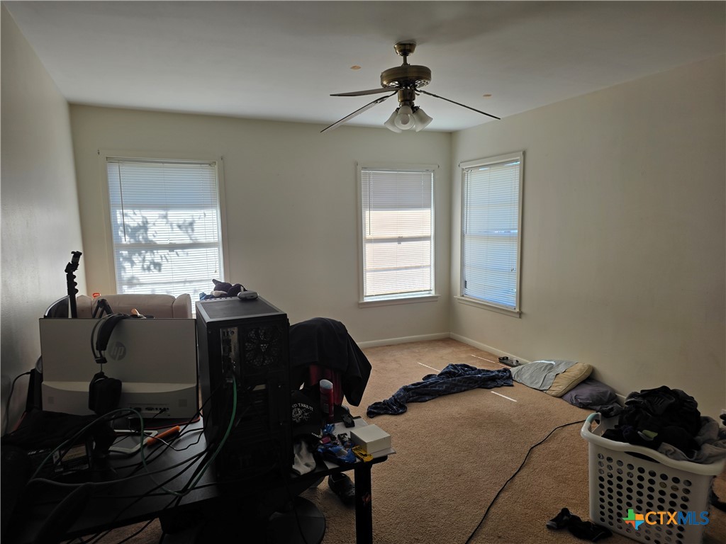 1903 South 13th Street Temple, TX 76504 - Photo 15 of 18 a bedroom with furniture and a window