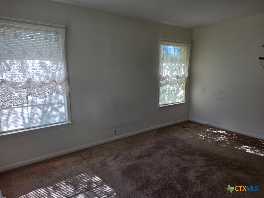 1903 South 13th Street Temple, TX 76504 - Photo 8 of 18 a view of an empty room and window