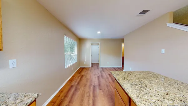 a view of a big room with wooden floor and closet