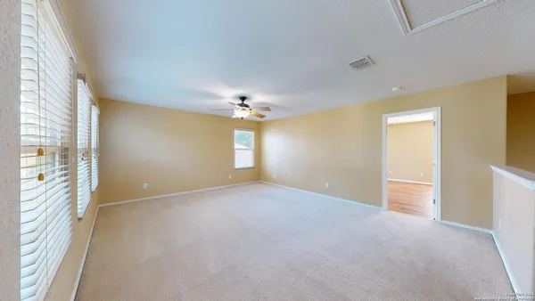 a view of an empty room with a window