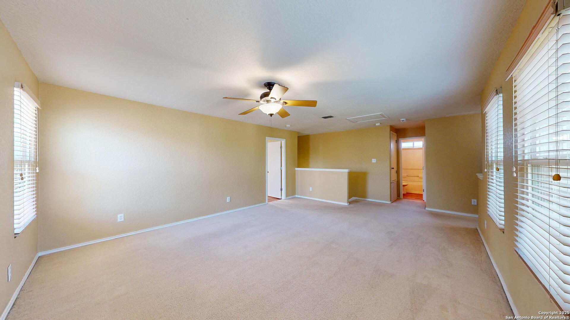 117 Foxglove Pass Cibolo, TX 78108 - Photo 20 of 46 a view of a livingroom with a ceiling fan and window