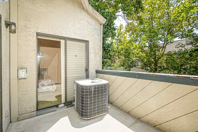 a balcony with view of outdoor space