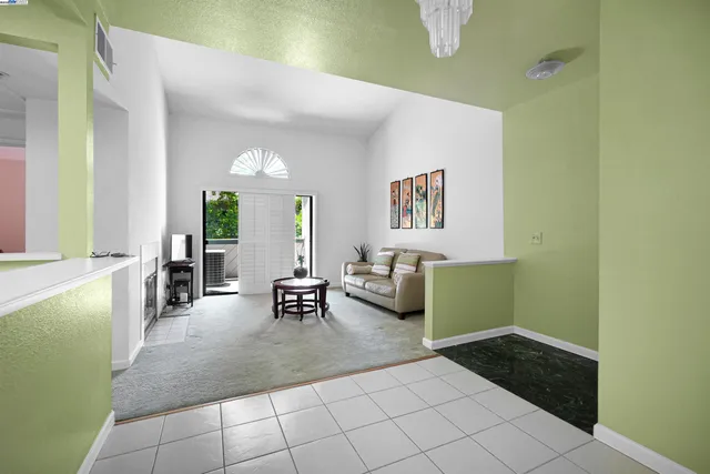 a lobby with furniture and window