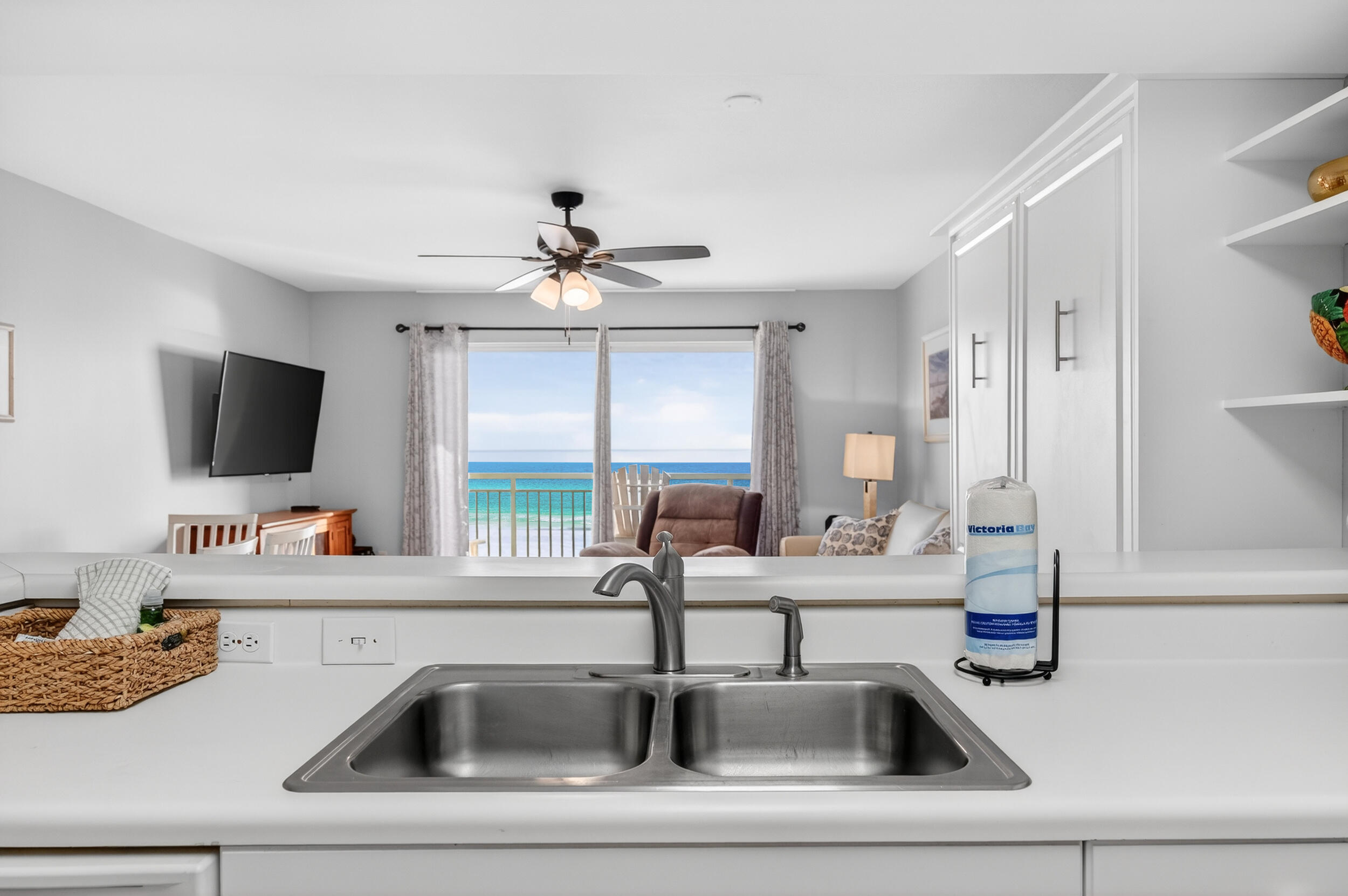 866 Santa Rosa Boulevard, Unit 317 Fort Walton Beach, FL 32548 - Photo 15 of 46 a kitchen view with a sink and a flat screen tv