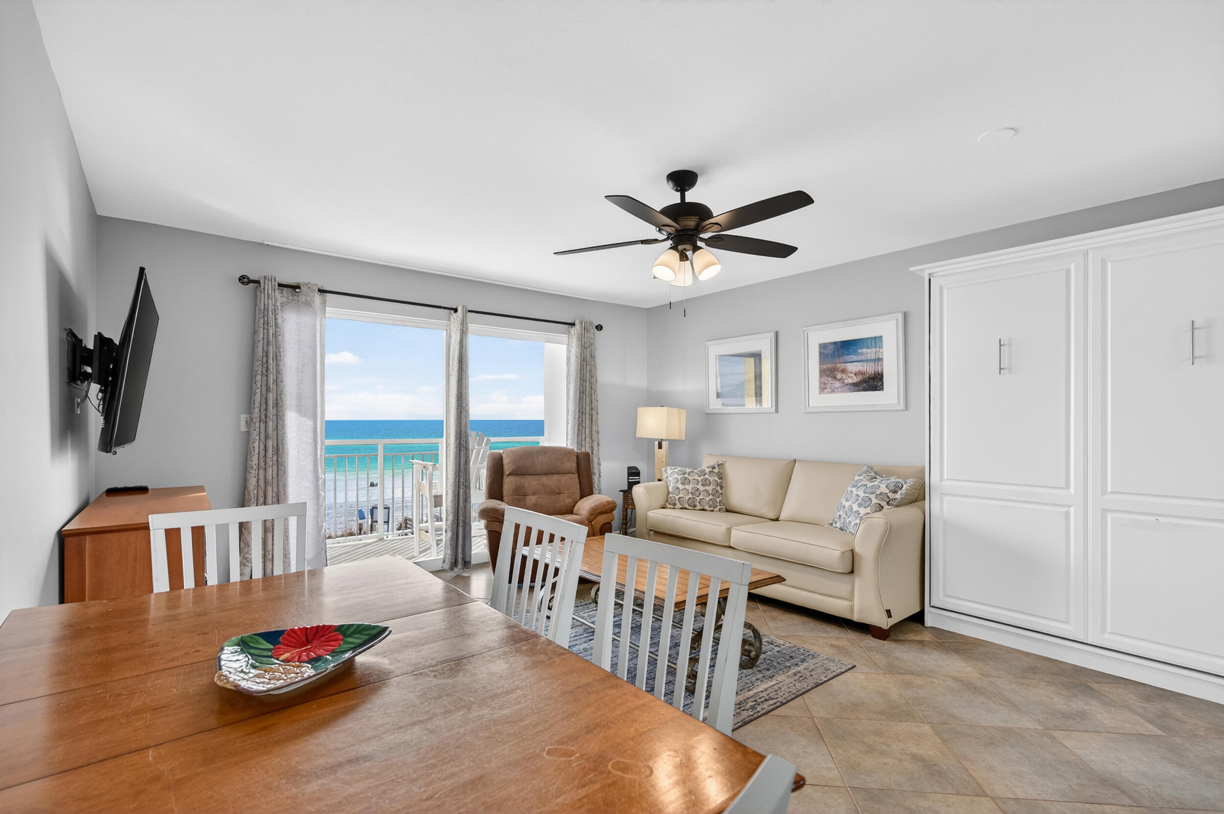 866 Santa Rosa Boulevard, Unit 317 Fort Walton Beach, FL 32548 - Photo 17 of 46 a living room with furniture fireplace and a flat screen tv