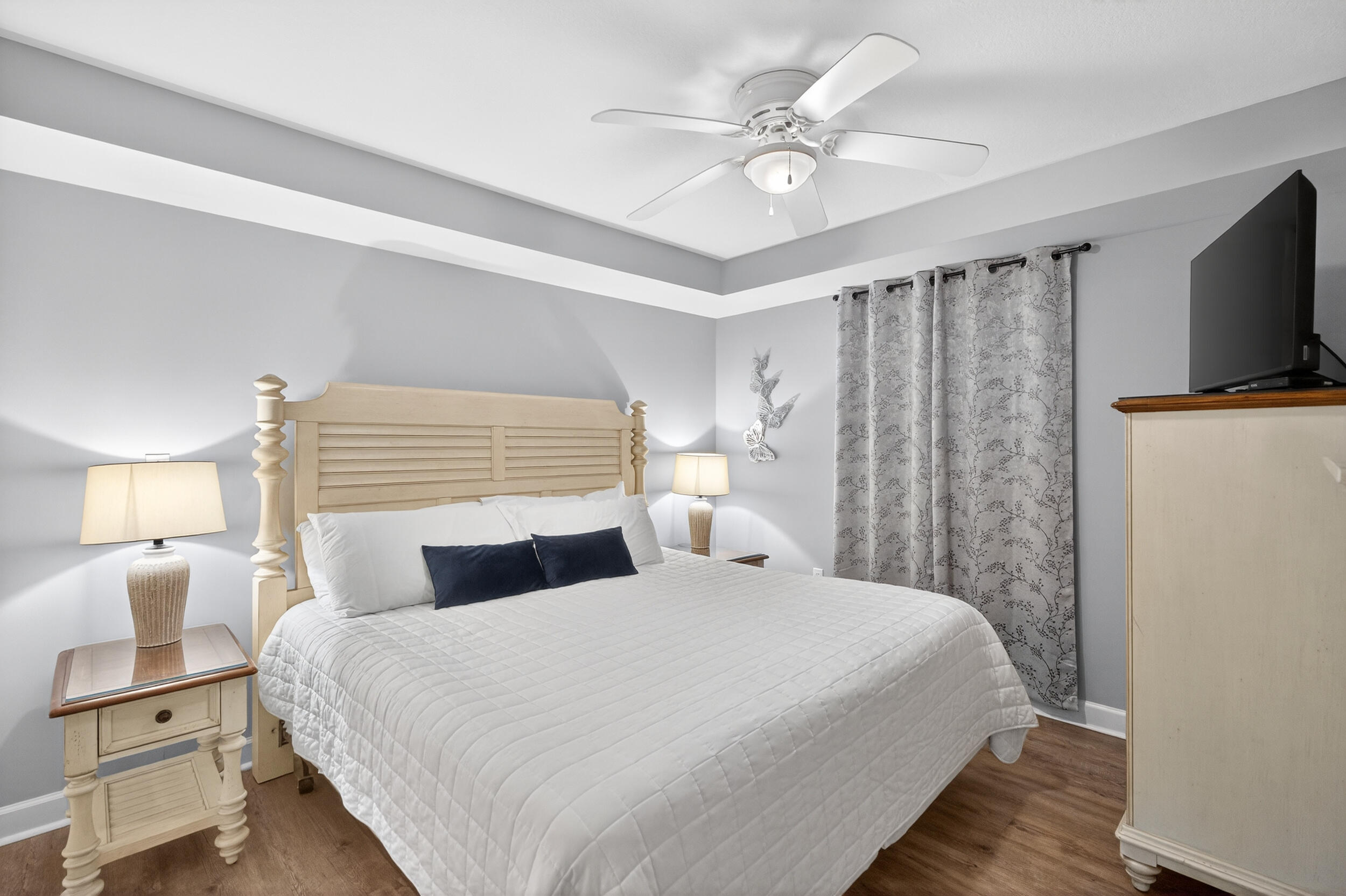 866 Santa Rosa Boulevard, Unit 317 Fort Walton Beach, FL 32548 - Photo 2 of 46 a bedroom with a bed and a flat screen tv