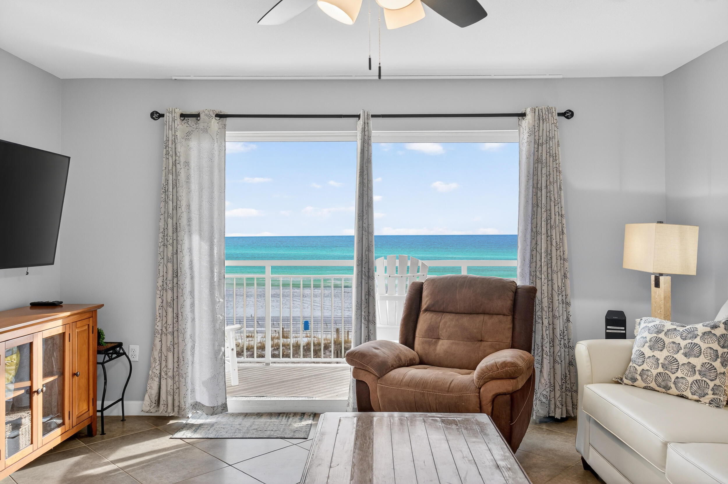 866 Santa Rosa Boulevard, Unit 317 Fort Walton Beach, FL 32548 - Photo 21 of 46 a living room with furniture and a flat screen tv