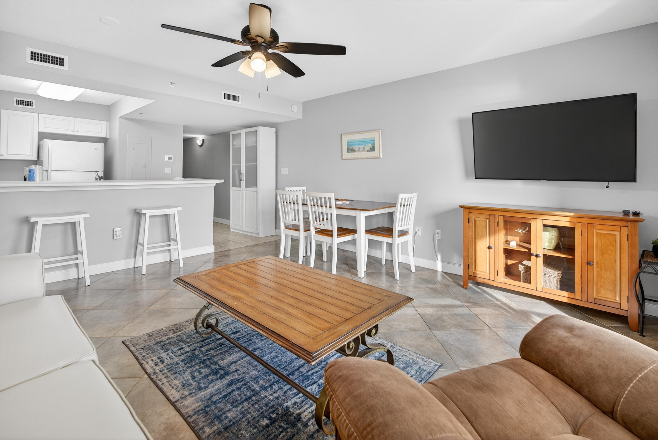 866 Santa Rosa Boulevard, Unit 317 Fort Walton Beach, FL 32548 - Photo 22 of 46 a living room with furniture and a flat screen tv