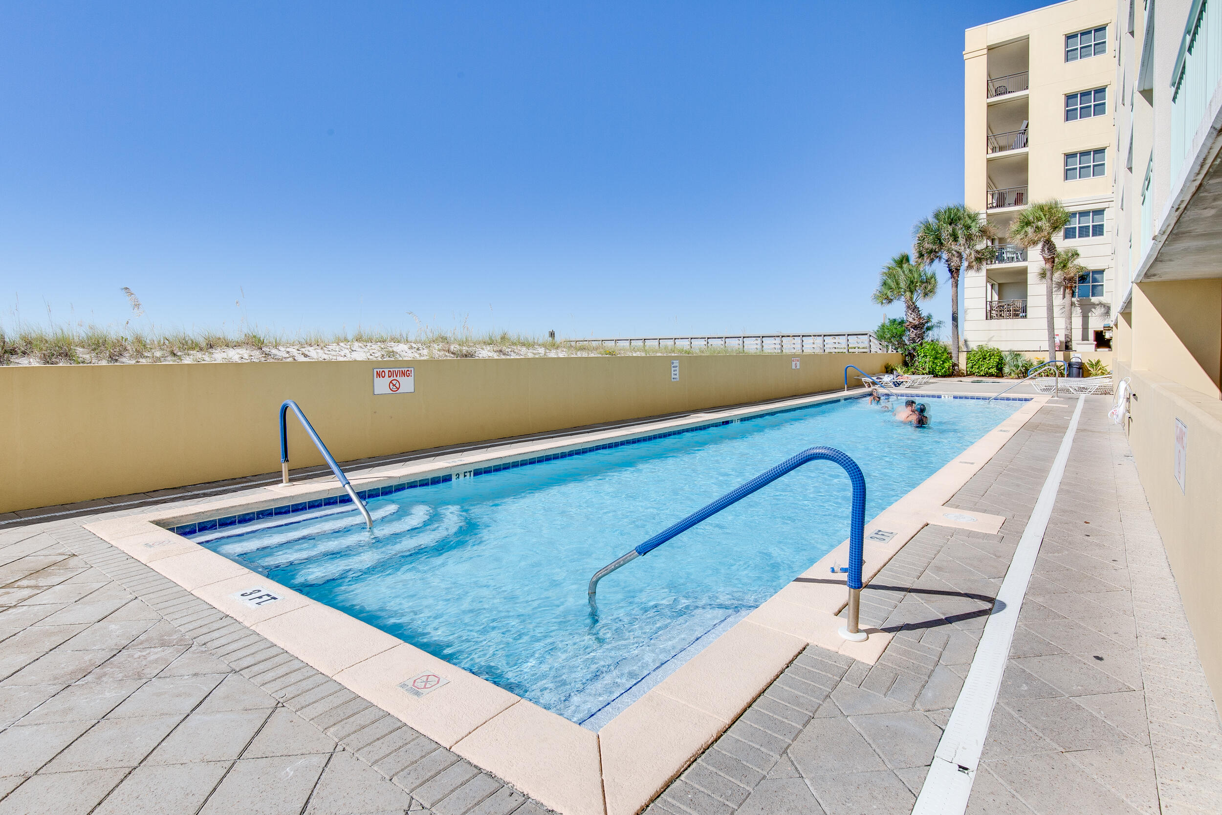 866 Santa Rosa Boulevard, Unit 317 Fort Walton Beach, FL 32548 - Photo 43 of 46 a view of a swimming pool with an ocean view