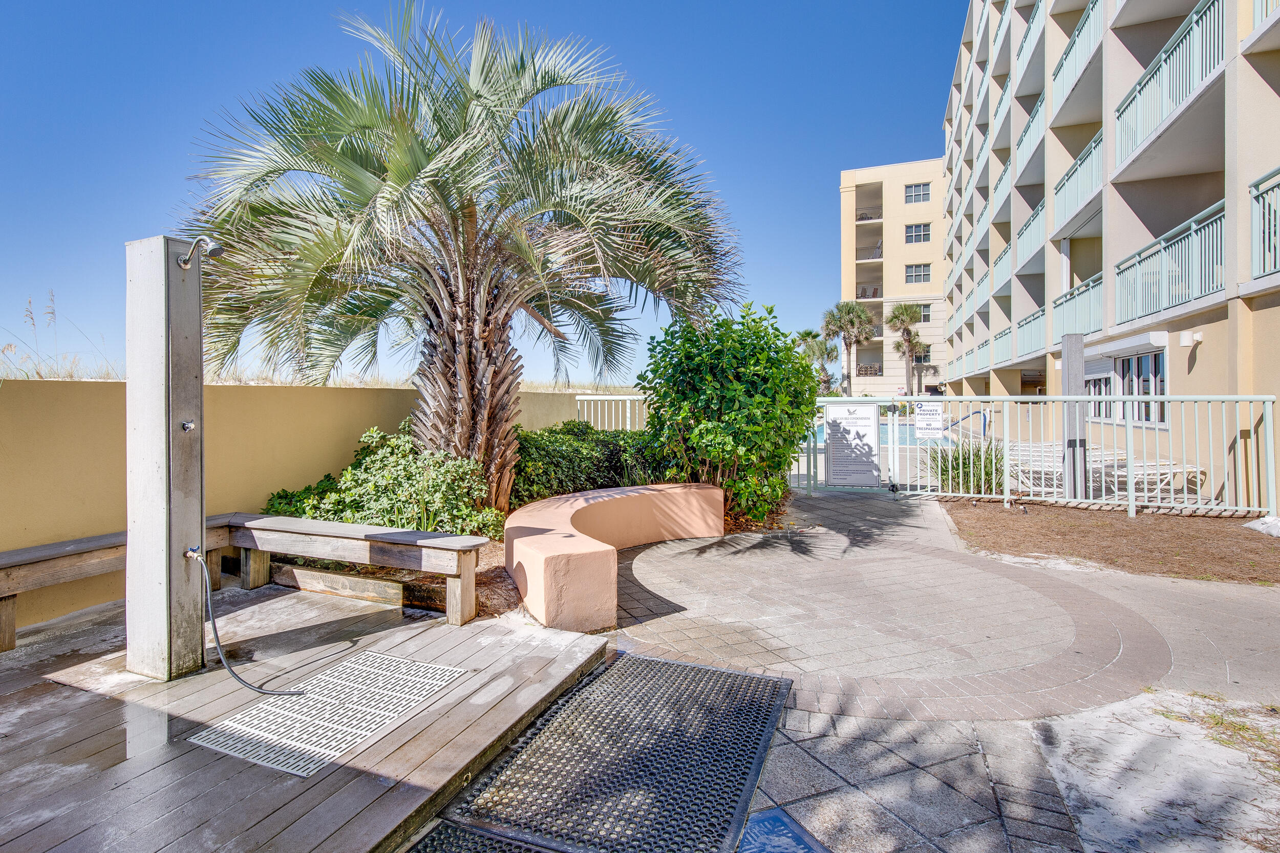 866 Santa Rosa Boulevard, Unit 317 Fort Walton Beach, FL 32548 - Photo 45 of 46 a view of a patio with couches and a potted plant on a table and chair