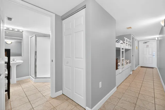 a view of a hallway with a bathroom