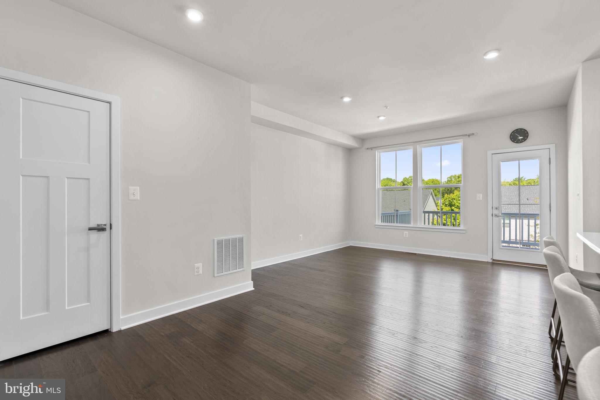 733 Iron Gate Road Bel Air, MD 21014 - Photo 13 of 41 an empty room with wooden floor and windows