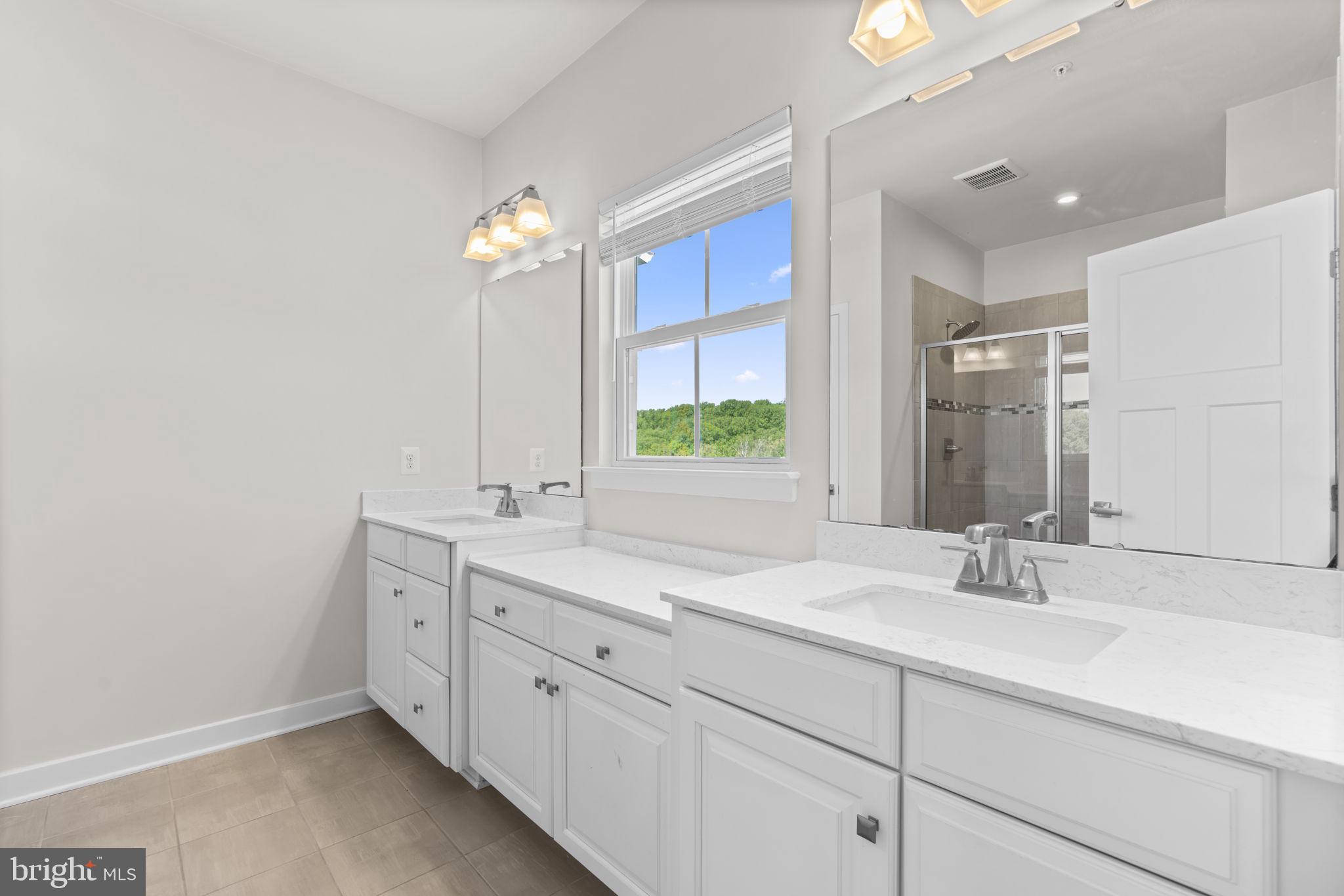 733 Iron Gate Road Bel Air, MD 21014 - Photo 20 of 41 a bathroom with a double vanity sink and a mirror