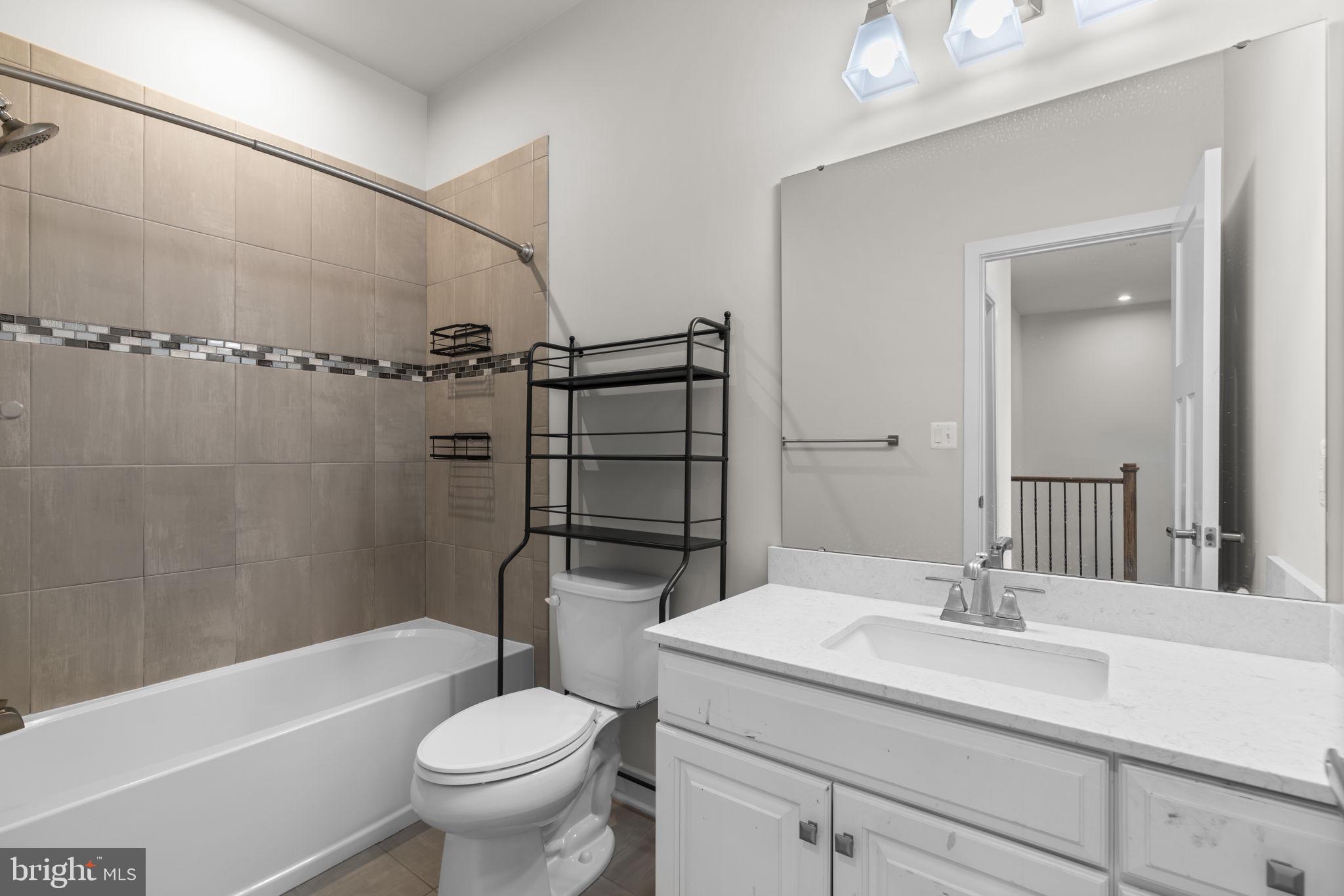 733 Iron Gate Road Bel Air, MD 21014 - Photo 28 of 41 a bathroom with a sink toilet and shower