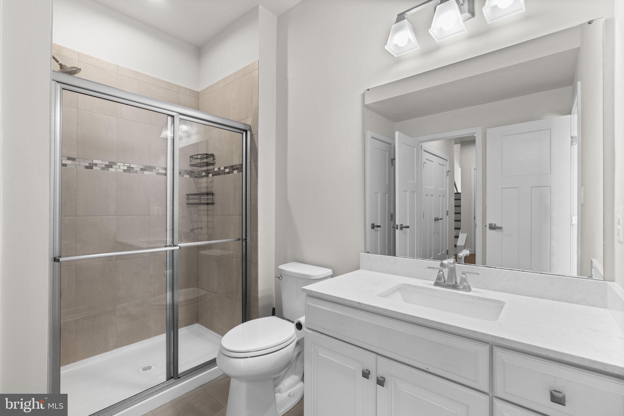 733 Iron Gate Road Bel Air, MD 21014 - Photo 30 of 41 a bathroom with a sink toilet and shower