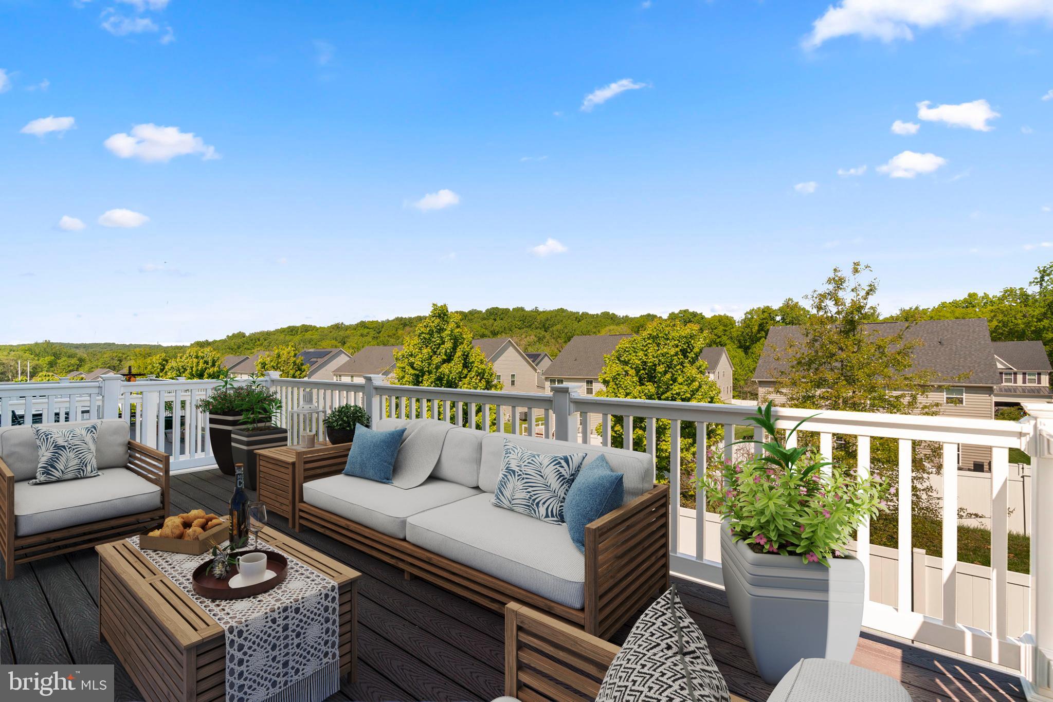 733 Iron Gate Road Bel Air, MD 21014 - Photo 35 of 41 a view of a balcony with couches and wooden floor