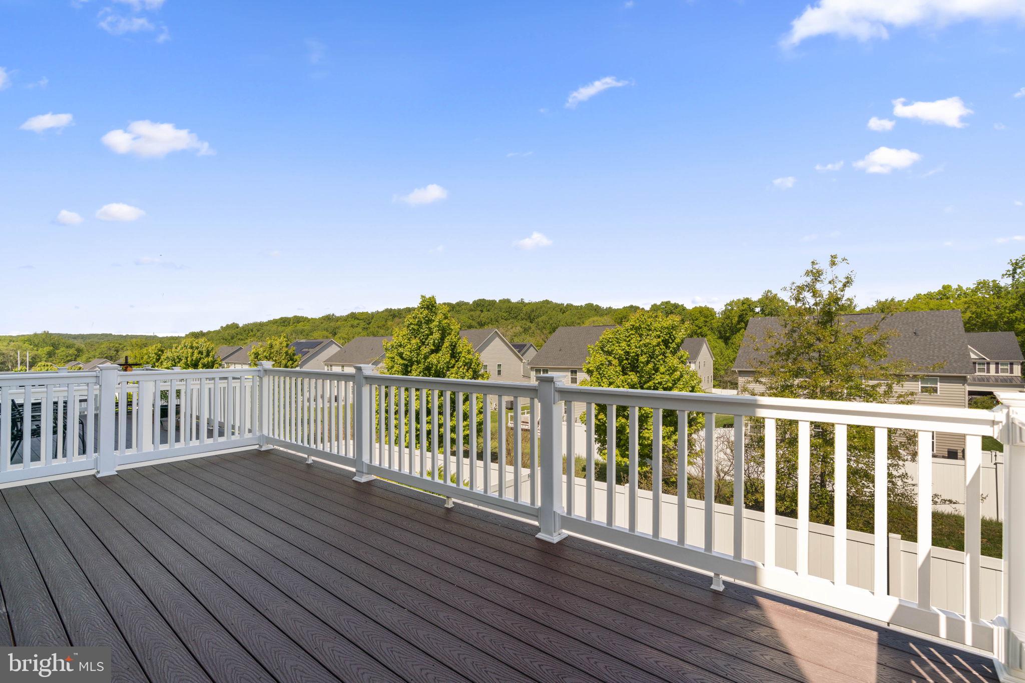 733 Iron Gate Road Bel Air, MD 21014 - Photo 36 of 41 a balcony with wooden floor and fence