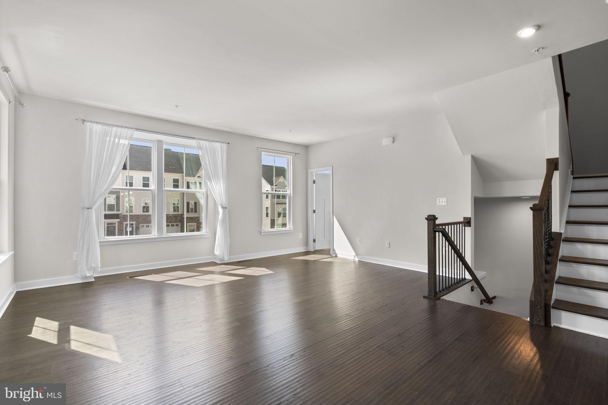 733 Iron Gate Road Bel Air, MD 21014 - Photo 4 of 41 a view of an empty room with wooden floor and a window