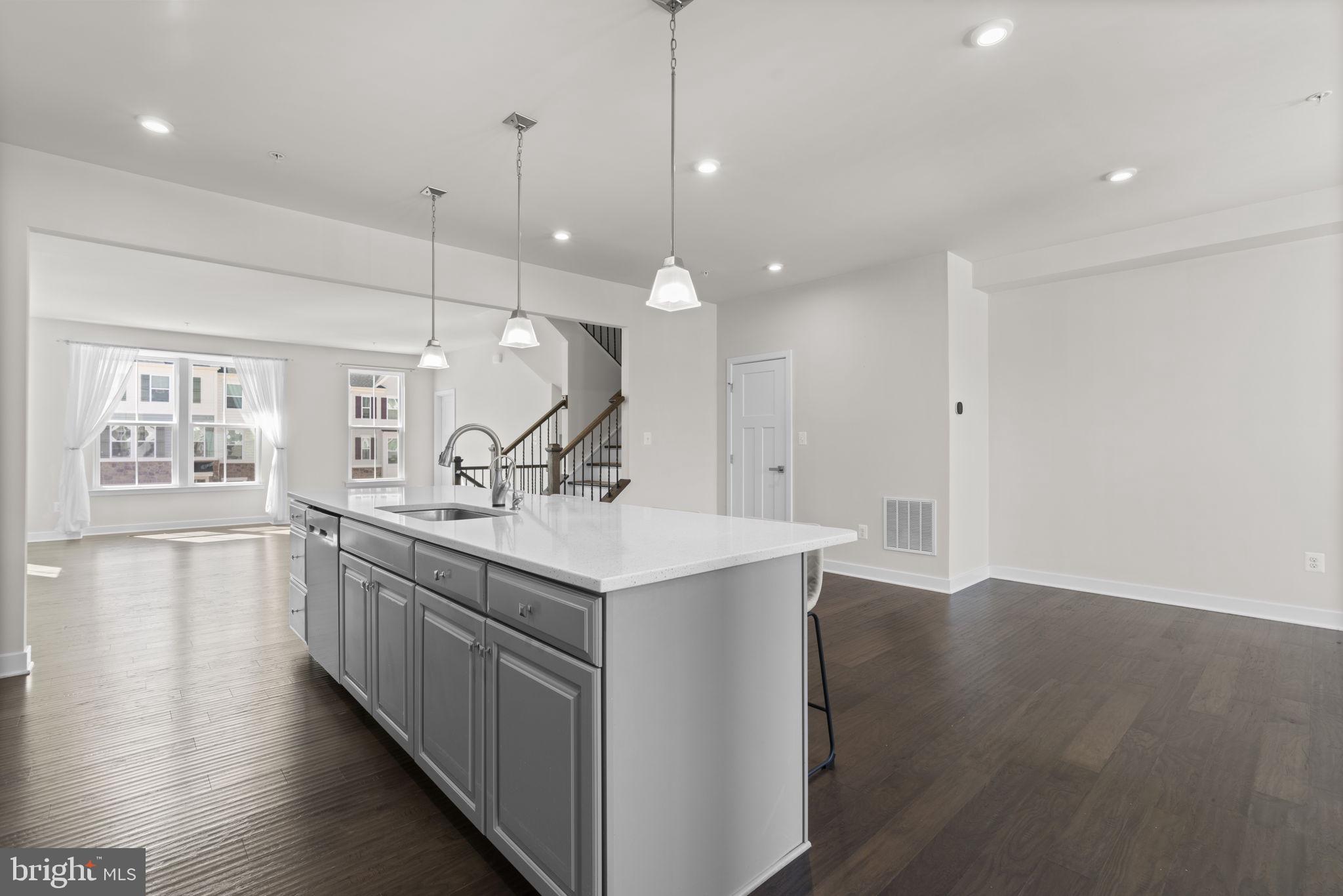 733 Iron Gate Road Bel Air, MD 21014 - Photo 9 of 41 a kitchen with counter top space sink and center island