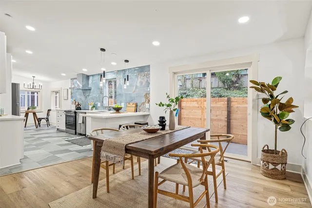 a view of a dining room with furniture window and wooden floor
