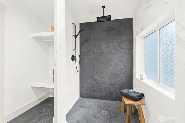 a bedroom with a bed and a couch