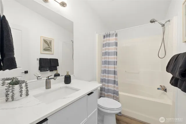 a utility room with sink dryer and washer