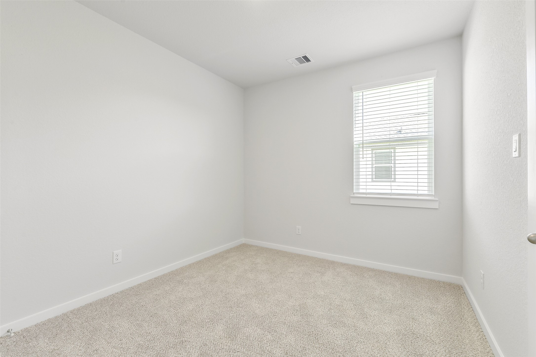 25980 Liberation Road Cleveland, TX 77328 - Photo 21 of 42 an empty room with a window