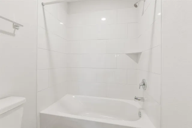 a close up of a bathtub curtain