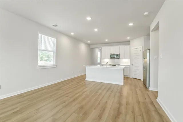 a view of kitchen with wooden floor