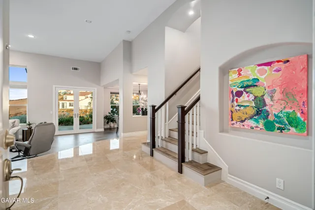 a kitchen with stainless steel appliances a sink and a stove top oven