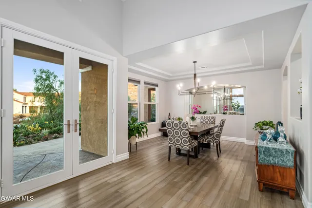 a bedroom with a bed and a mirror