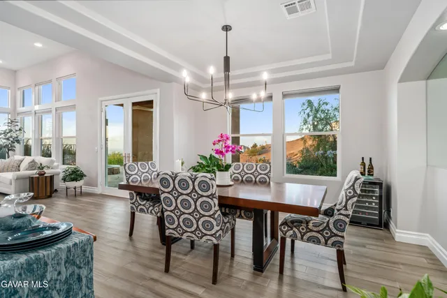 a hallway with cabinets and wooden floor