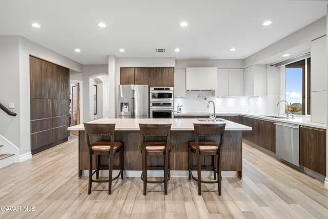 a utility room with sink dryer and washer