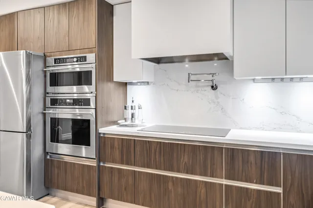 a view of a bedroom with furniture and wooden floor