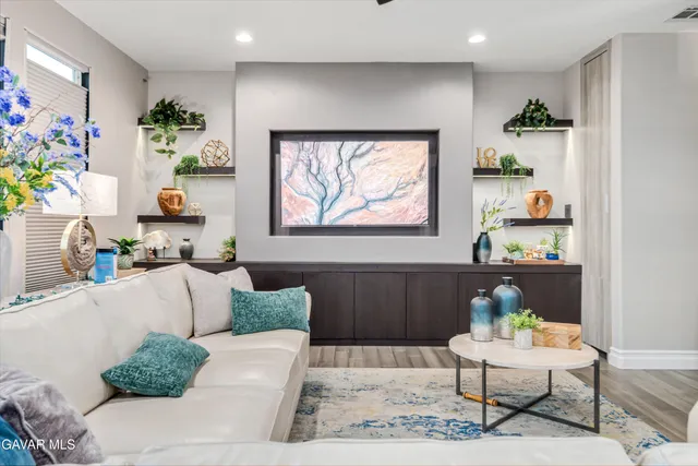a bathroom with a shower sink and mirror