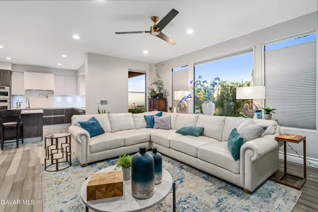 a bath room with a bed furniture and a large window