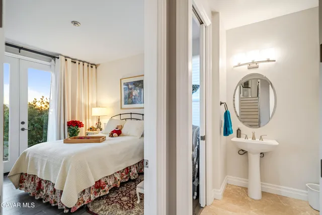 a kitchen with stainless steel appliances granite countertop a sink a stove and a wooden cabinets