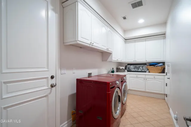 a view of a porch with furniture and floor to ceiling windows