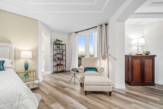 an aerial view of residential houses with outdoor space and ocean view