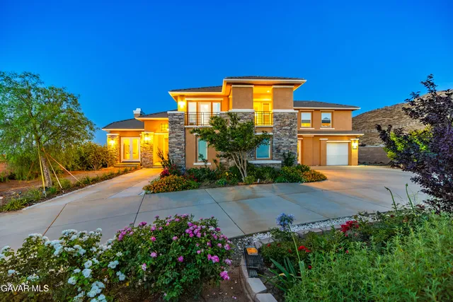 a dining room with furniture garden view and a chandelier