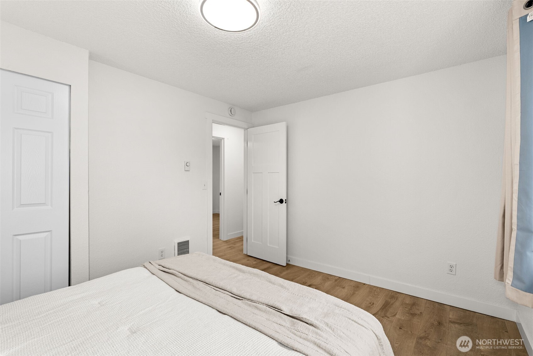 18821 Guava Street Southwest Rochester, WA 98579 - Photo 12 of 28 a bedroom with a bed and a window