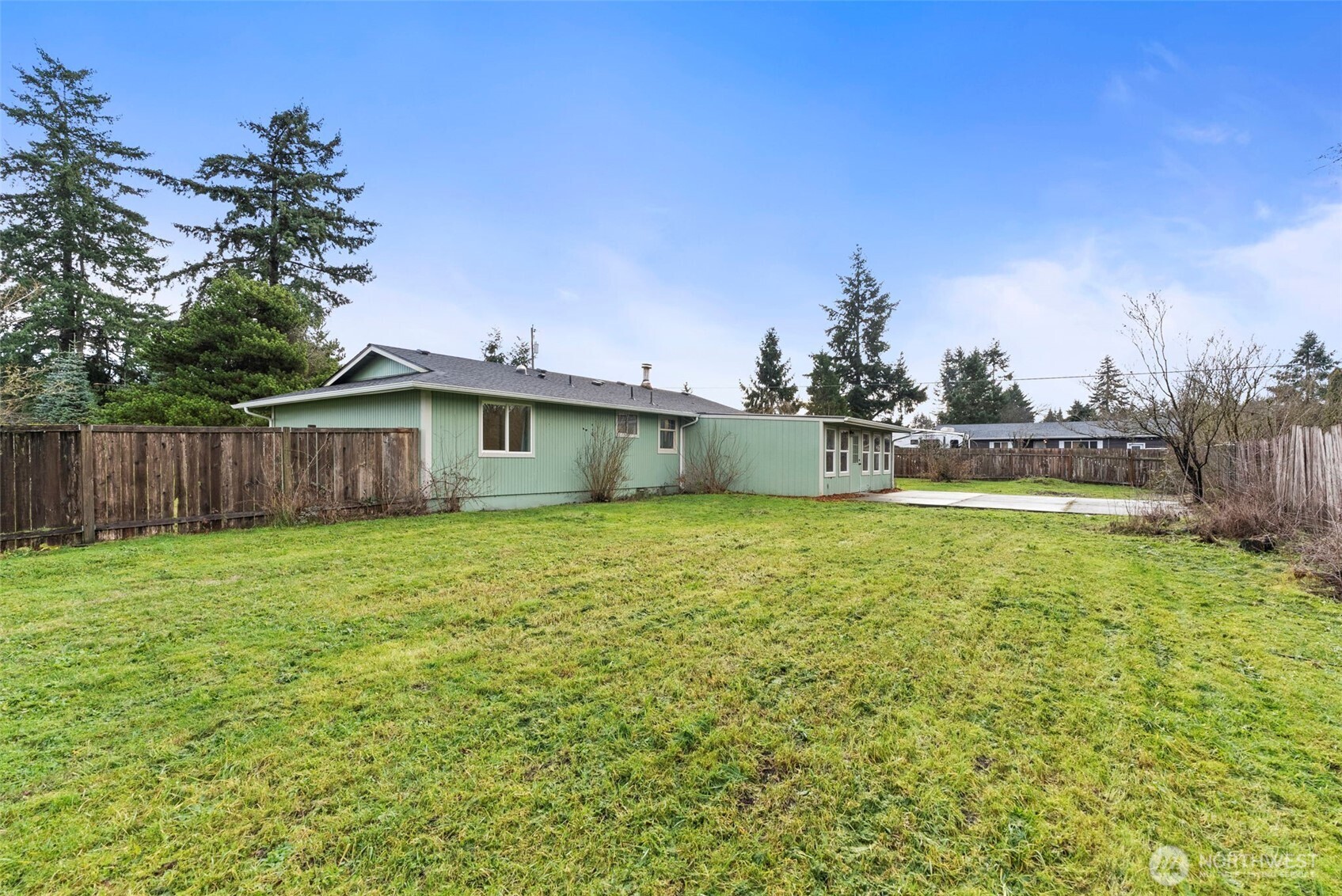 18821 Guava Street Southwest Rochester, WA 98579 - Photo 21 of 28 a front view of a house with garden
