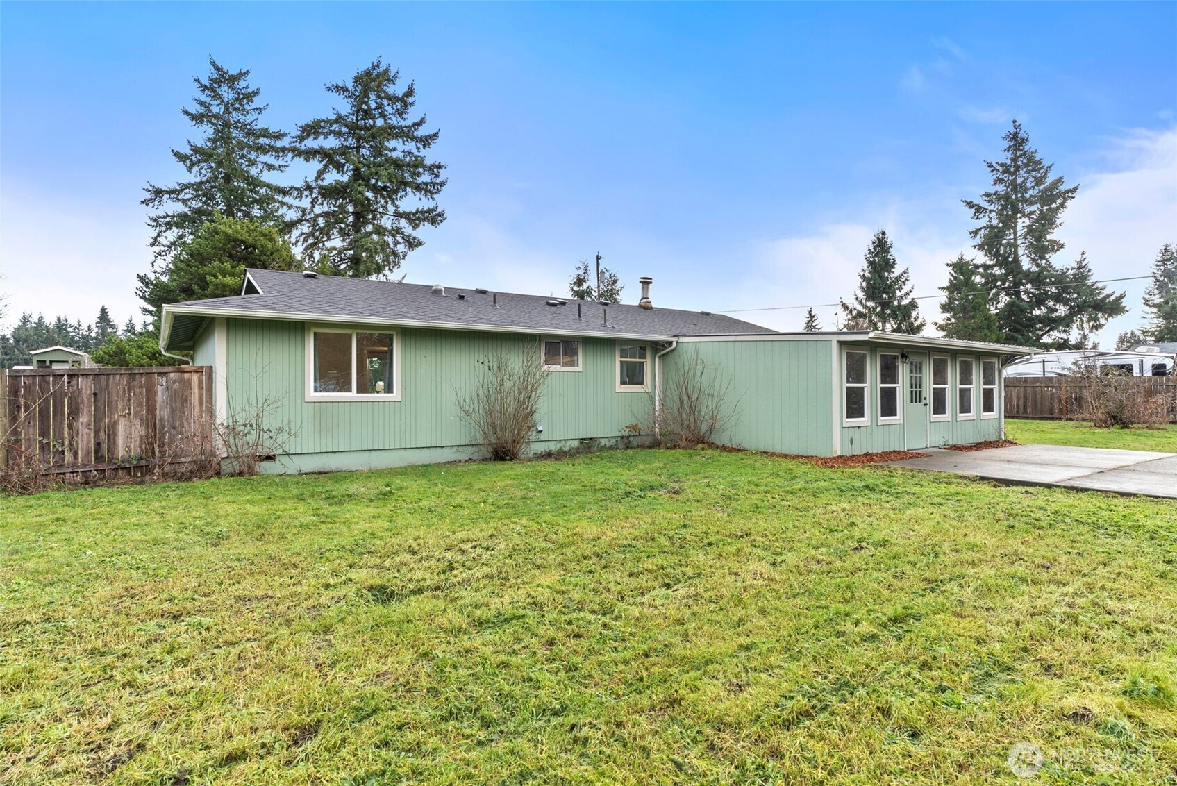 18821 Guava Street Southwest Rochester, WA 98579 - Photo 22 of 28 a view of a house with a backyard