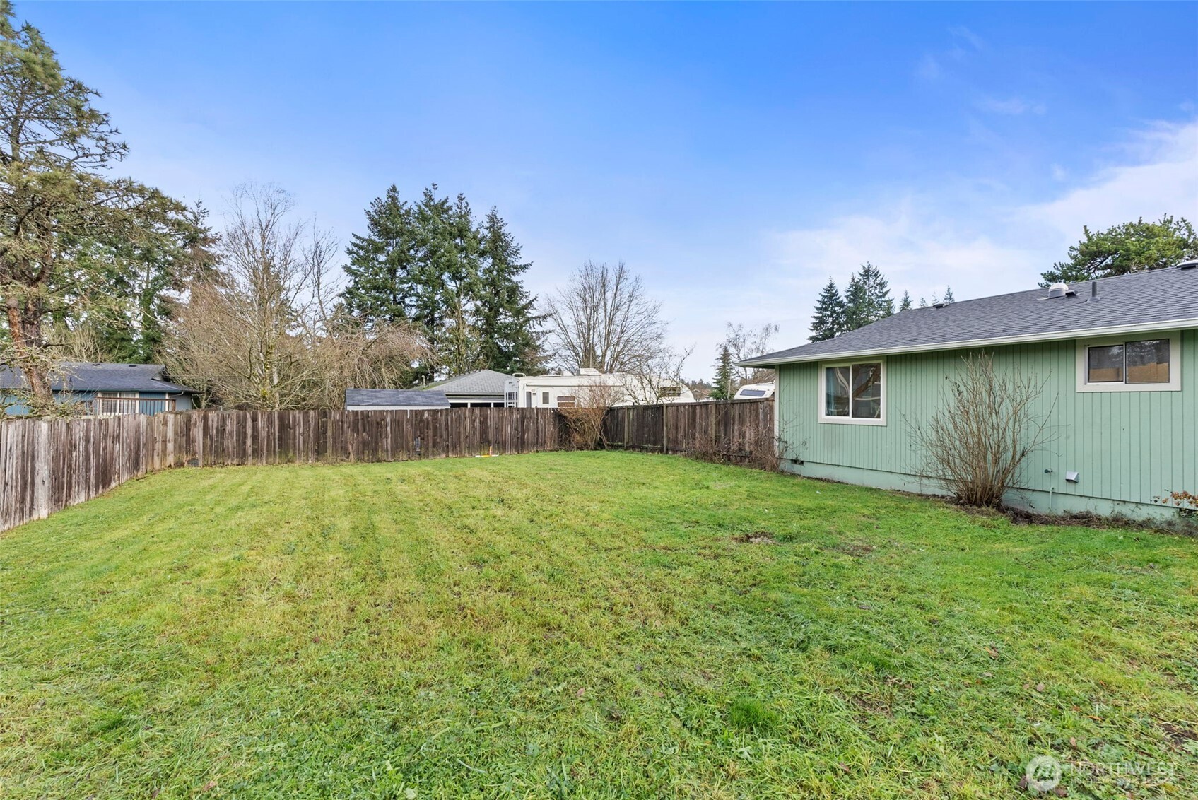 18821 Guava Street Southwest Rochester, WA 98579 - Photo 24 of 28 a backyard of a house with lots of green space