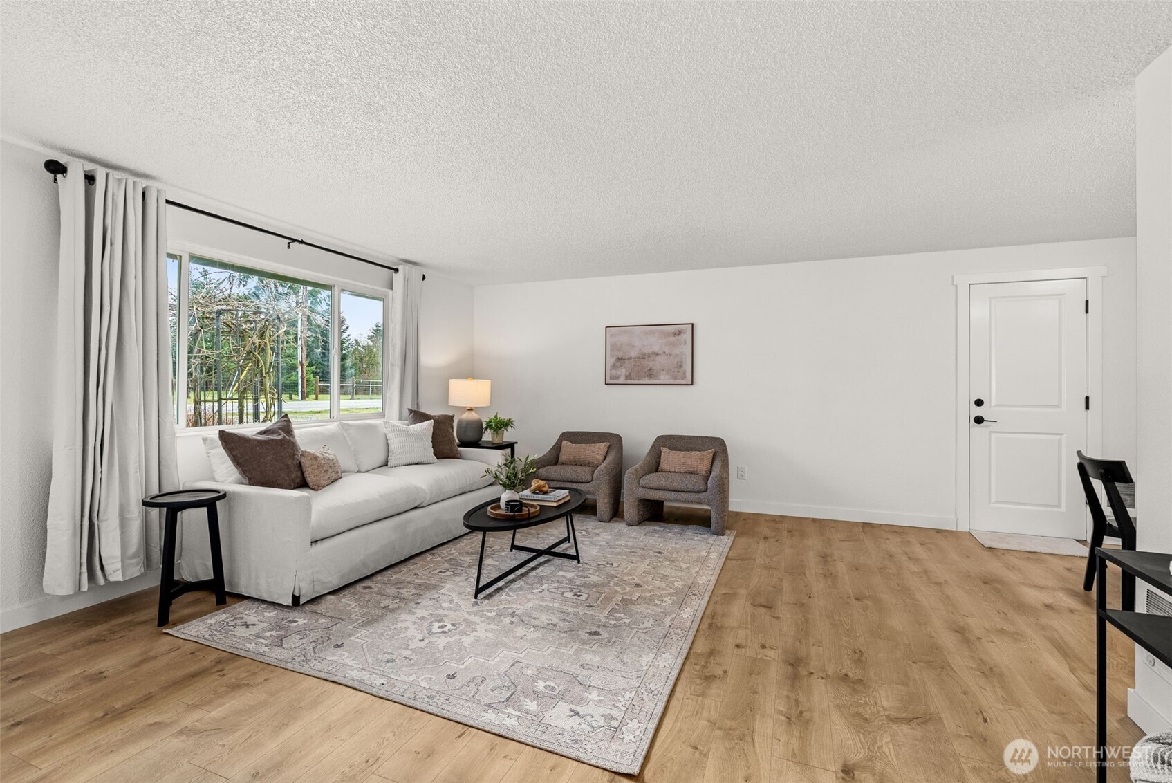 18821 Guava Street Southwest Rochester, WA 98579 - Photo 3 of 28 a living room with furniture and a window